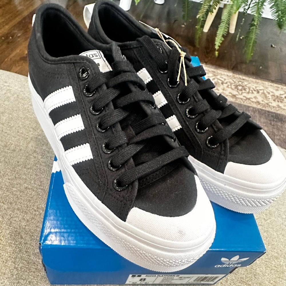 Never worn.  Adidas Nizza platform black sneakers.  With box.